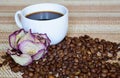 A white Cup of black strong coffee and a dried rose. Royalty Free Stock Photo