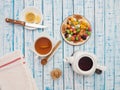 Cup of tea with lemon, a teapot and dried fruits on a wooden table Royalty Free Stock Photo