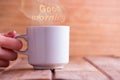 White cup on blue wooden table. Royalty Free Stock Photo