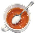 White Cup of Brown Tea with Sugar on Spoon Royalty Free Stock Photo