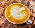 White cup of caffe latte coffee with rosette milk latte art Royalty Free Stock Photo