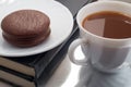 White cup with cocoa and chocolate covered biscuit Royalty Free Stock Photo