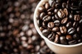 White cup on the coffee beans