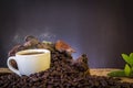 White cup and coffee beans and dark background Royalty Free Stock Photo