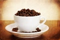 White cup of coffee beans Royalty Free Stock Photo