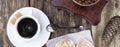 A white cup of coffee and cake on a wooden background. Banner. A coffee grinder on a wooden table, Cone