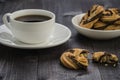 White cup of coffee and cookies/white cup of coffee and cookies on a wooden dark table Royalty Free Stock Photo