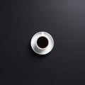 A white cup of coffee on a dark grey desk background Royalty Free Stock Photo