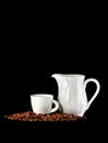 White cup of coffee, mug and coffee beans on black background Royalty Free Stock Photo