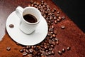 White cup with coffee near coffee beans Royalty Free Stock Photo