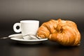White cup coffee, spoon and croissant Royalty Free Stock Photo