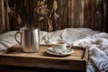 a white cup of coffee with a spoon on a metal tray, on a rustic wooden bed Royalty Free Stock Photo