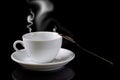 White cup of coffee with spoon and steam Royalty Free Stock Photo