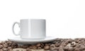 White cup with coffee on sprinkled roasted beans. White background. Space for text Royalty Free Stock Photo