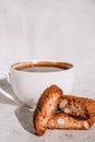White cup of coffee and traditional homemade italian cantuccini cookies. Biscotti Cantuccini Cookie Biscuits with Royalty Free Stock Photo