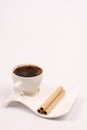 White cup of coffee with wafer chocolate cream rolls Royalty Free Stock Photo