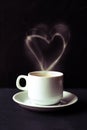 White cup of espresso coffee with heart shaped smoke Royalty Free Stock Photo