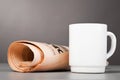 White cup and folded newspaper Royalty Free Stock Photo