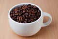 A White Cup Full Of Coffee Bean Royalty Free Stock Photo
