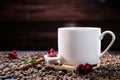 White cup full of coffee beans , red flowers and red chocolate candy against the background of a red wood wall. Royalty Free Stock Photo