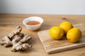 A white cup of green natural tea with ginger, lemon and honey on wooden rustic background. Royalty Free Stock Photo