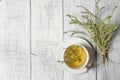 White cup of healthy herbal thyme tea with fresh thyme leaves bunch on white wooden rustic background Royalty Free Stock Photo