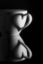 White cup with heart shadow Royalty Free Stock Photo