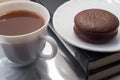 White cup of hot chocolate and a biscuit covered with chocolate Royalty Free Stock Photo