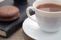 White cup of hot cocoa and a chocolate biscuit Royalty Free Stock Photo