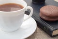 White cup of hot cocoa and a chocolate biscuit Royalty Free Stock Photo