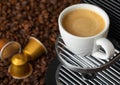 White cup with hot coffee from espresso machine pods on beans background Royalty Free Stock Photo