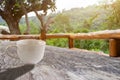 A white cup of hot espresso coffee mugs and roasted coffee beans placed on wooden floor background,coffee morning,selective focus Royalty Free Stock Photo