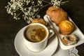 A white cup of instant coffee with plate of biscuits Royalty Free Stock Photo