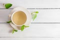 White cup of melissa herbal tea with fresh melissa leaf Royalty Free Stock Photo