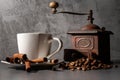 White cup and old coffee grinder Royalty Free Stock Photo