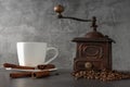 White cup and old coffee grinder Royalty Free Stock Photo