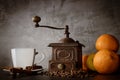 White cup and old coffee grinder Royalty Free Stock Photo