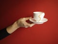 A white cup on a red background