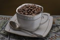 Coffee beans in Cup on brown background