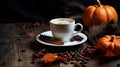 White cup of spike shaped coffee on a white plate on a rustic table with orange pumpkins