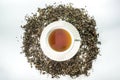 White cup of tea with dried tea leaf Royalty Free Stock Photo