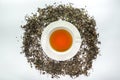 The White cup of tea with dried tea leaf Royalty Free Stock Photo