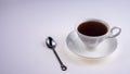 white cup of tea with iron spoon on white background, isolate Royalty Free Stock Photo