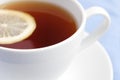 White cup of tea with lemon