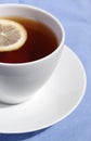 White cup of tea with lemon