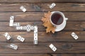 White cup of tea, maple leaves, domino game Royalty Free Stock Photo