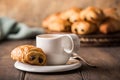 White cup of tea with mini chocolate bun Royalty Free Stock Photo