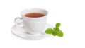 White Cup of tea with mint melissa herb isolated