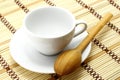 White cup with wooden spoon Royalty Free Stock Photo