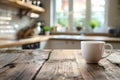 White cup on wooden table on blurred kitchen background Royalty Free Stock Photo